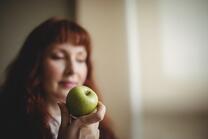 Picture of woman eating a healthy snack