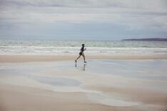 Picture of woman running on beach